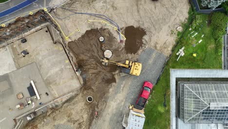 excavator working on construction moving dirt with shovel