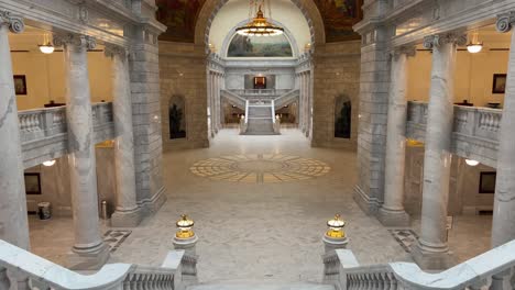 Looking-at-the-mid-way-landing-of-the-capital-marble-stairs-and-panning-up-slow-to-see-the-empty-Utah-state-capital