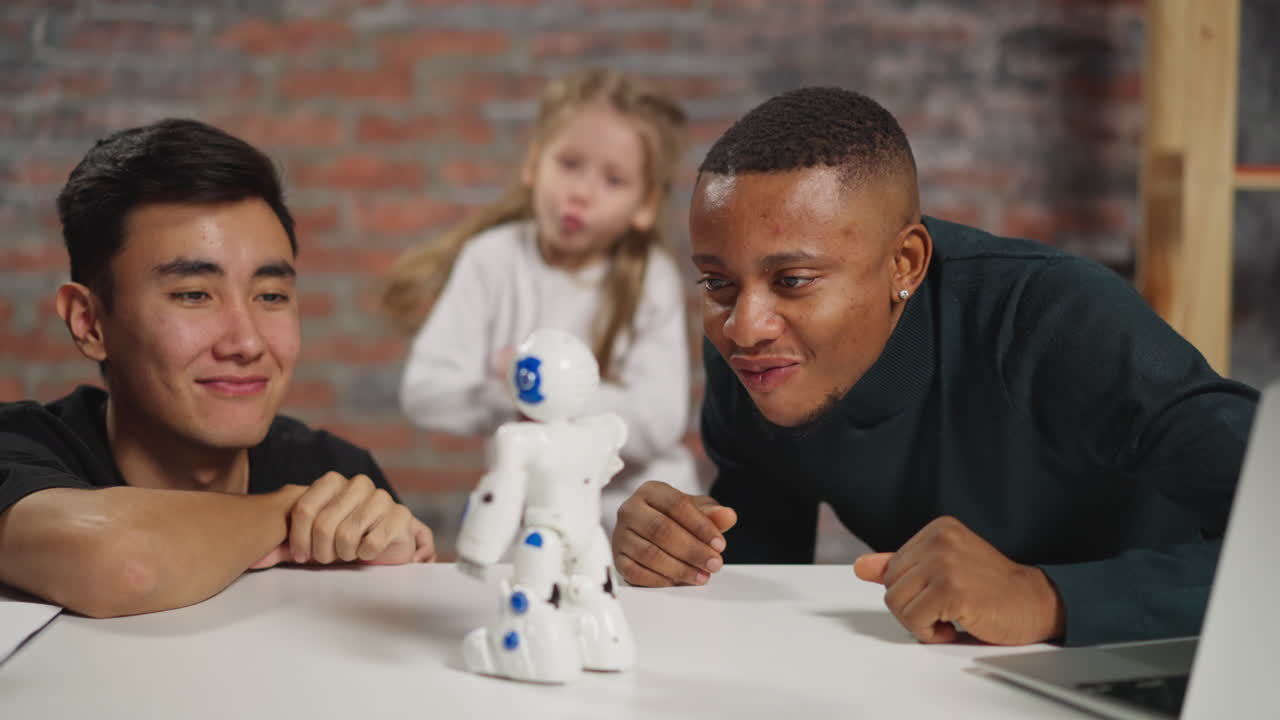 guy and Asian friend look at robot girl jumps