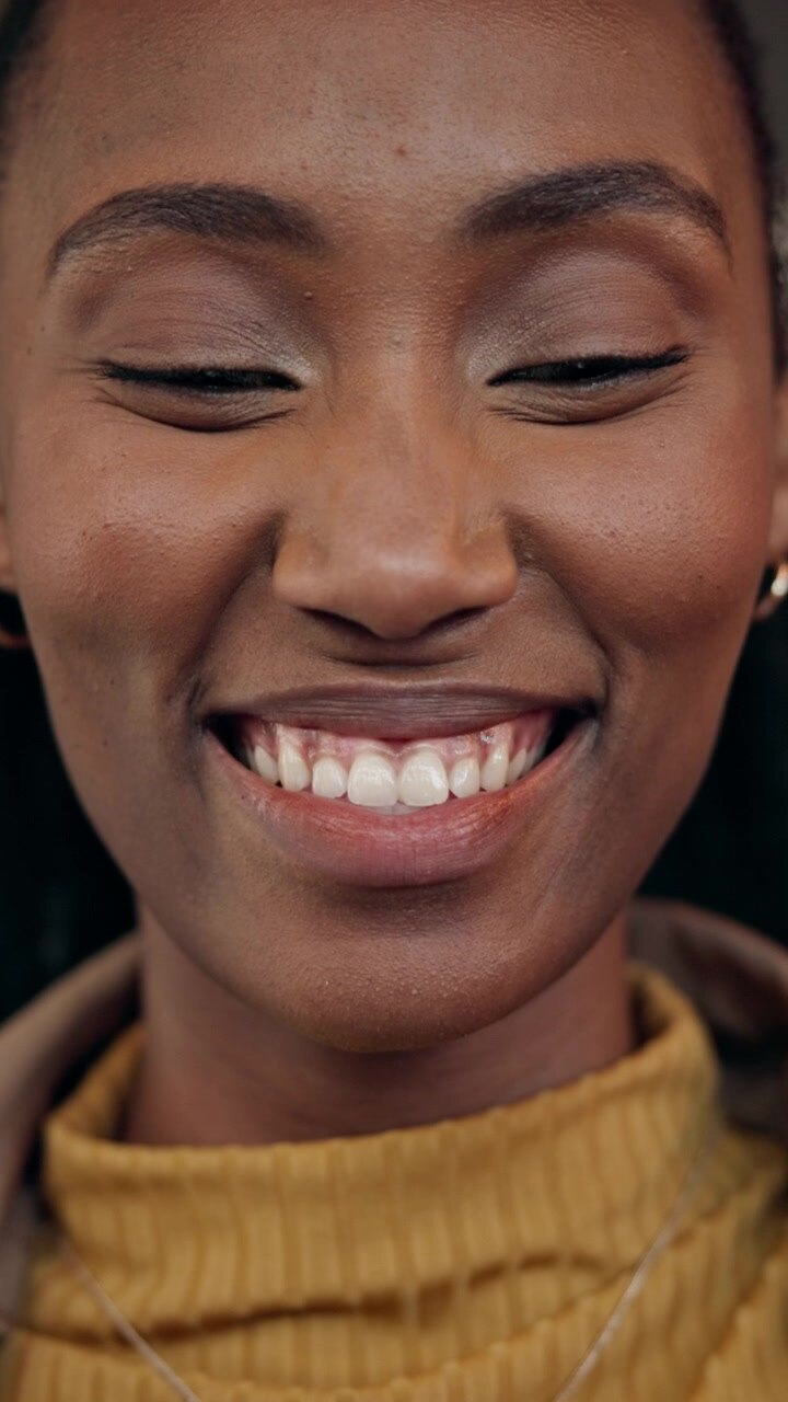 Close-up Portrait of a Smiling Young Woman