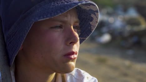 close-up portrait of a boy wearing a hat