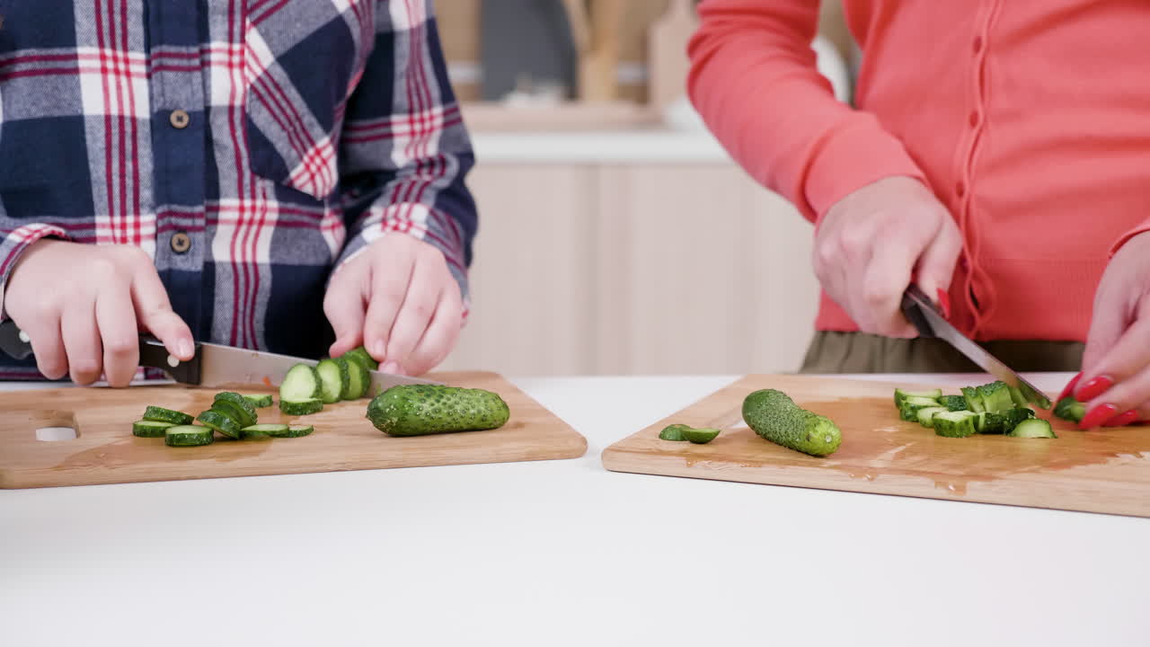 People cutting cucumber