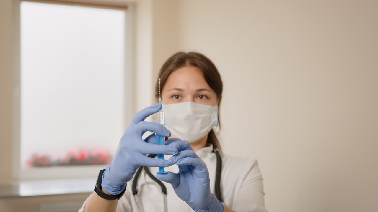 Doctor holding a syringe