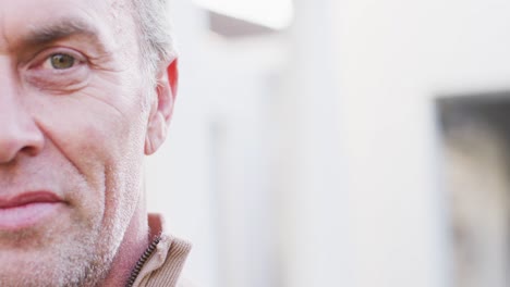 Portrait-of-happy-caucasian-man-looking-at-camera-and-smiling