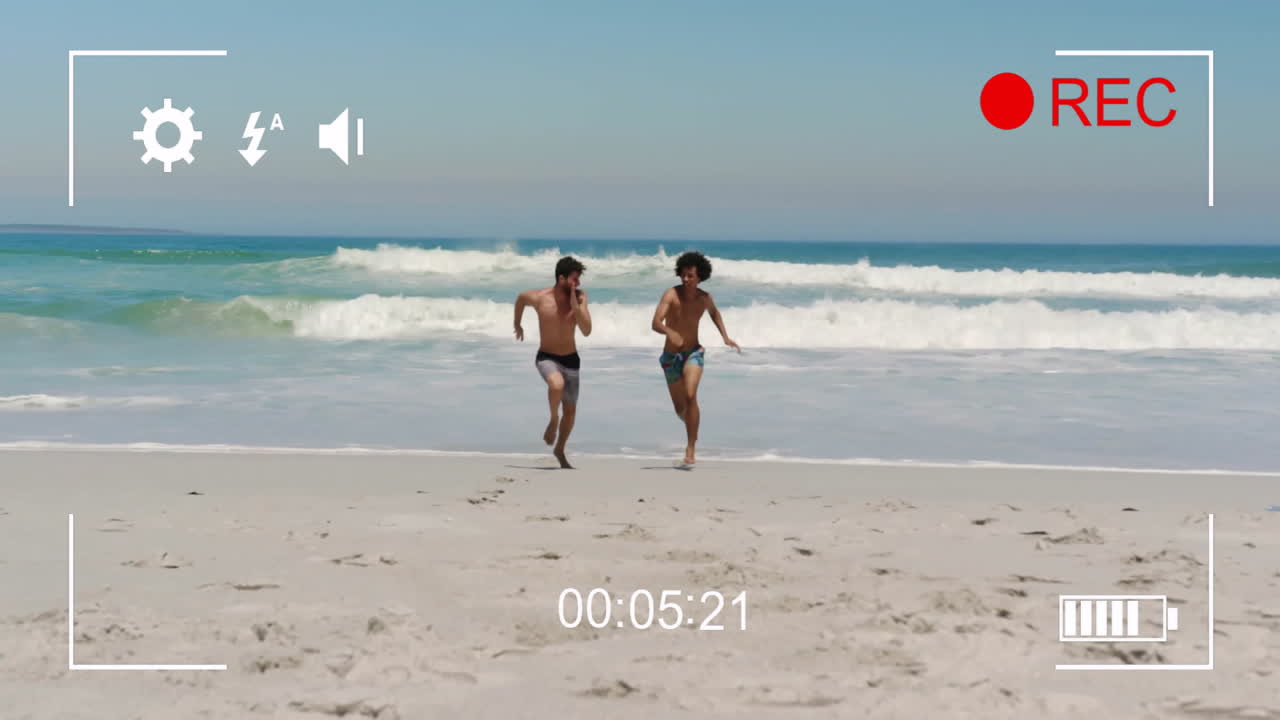 Running on beach, two boys captured in recording animation with timer and icons