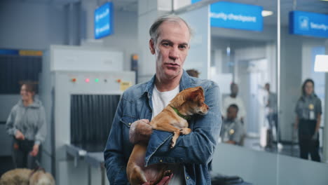 man with dog at airport security
