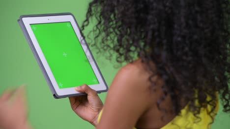 young beautiful hispanic woman using digital tablet
