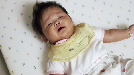 cute asian baby girl crying sulking to her parents