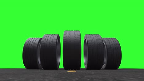 neumáticos de coche de bucle rodando en el asfalto en el verano en un fondo verde