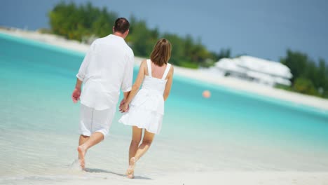 happy young caucasian couple together on island vacation