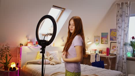 teenager creating content in her bedroom