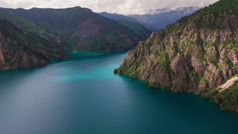 aerial footage of sary-chelek lake, kyrgyzstan lake blue water and mountains view