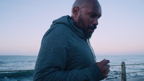 Fitness,-exercise-and-black-man-at-sea-promenade