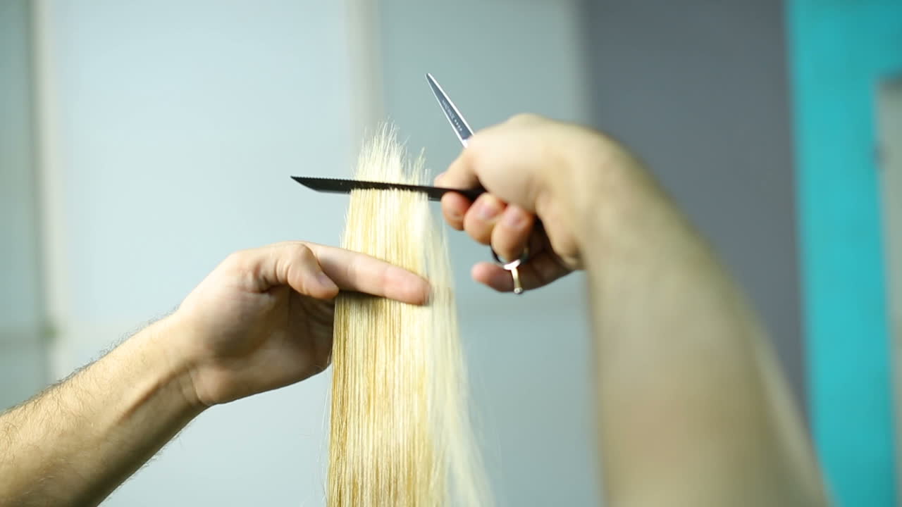 Hairdresser dying female hair. Woman client hair in beauty parlour hairdressing salon