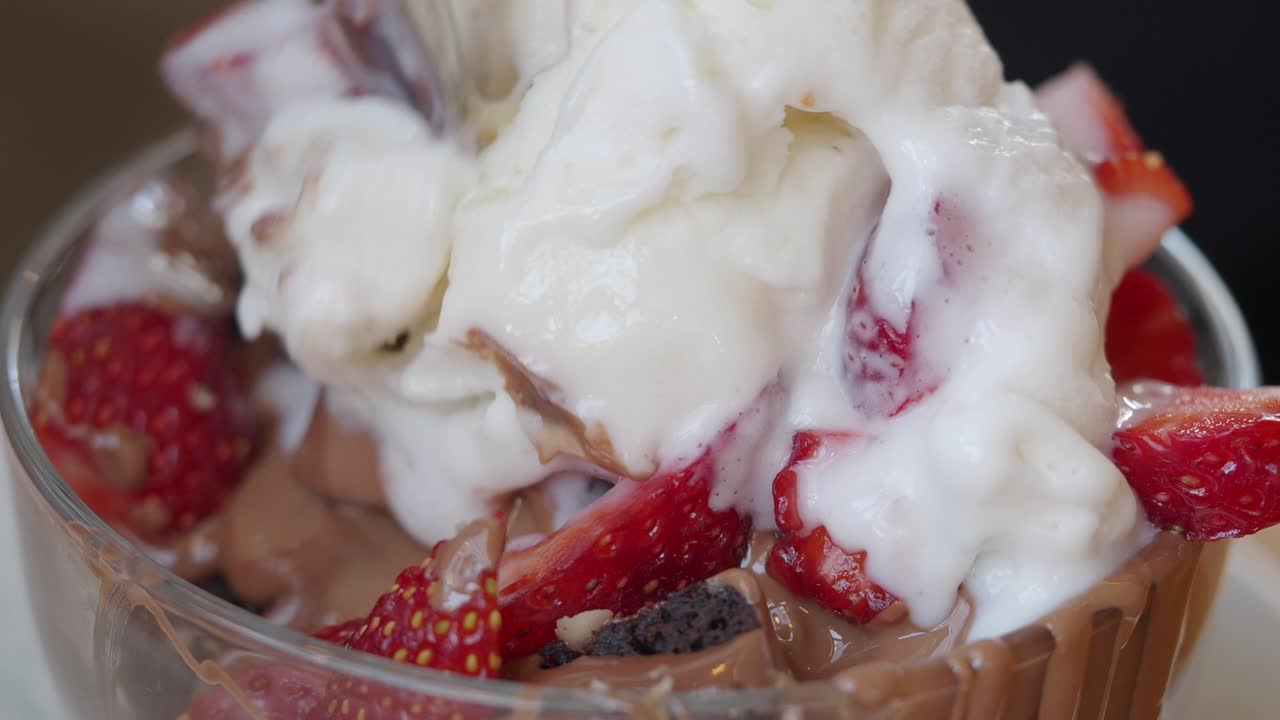 Ice cream dessert with strawberries and chocolate