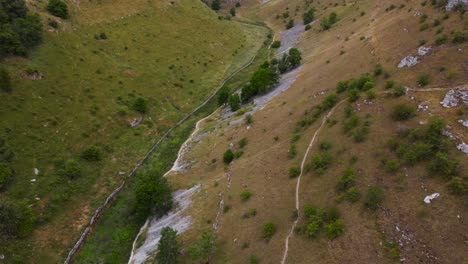 birdseye aerial view looking down hiking meadow valley in peak district rural countryside