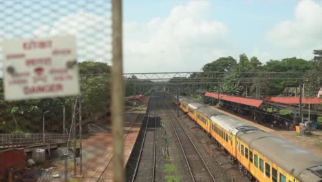 Revealing-shot-of-a-passenger-train-standing-at-the-railway-station