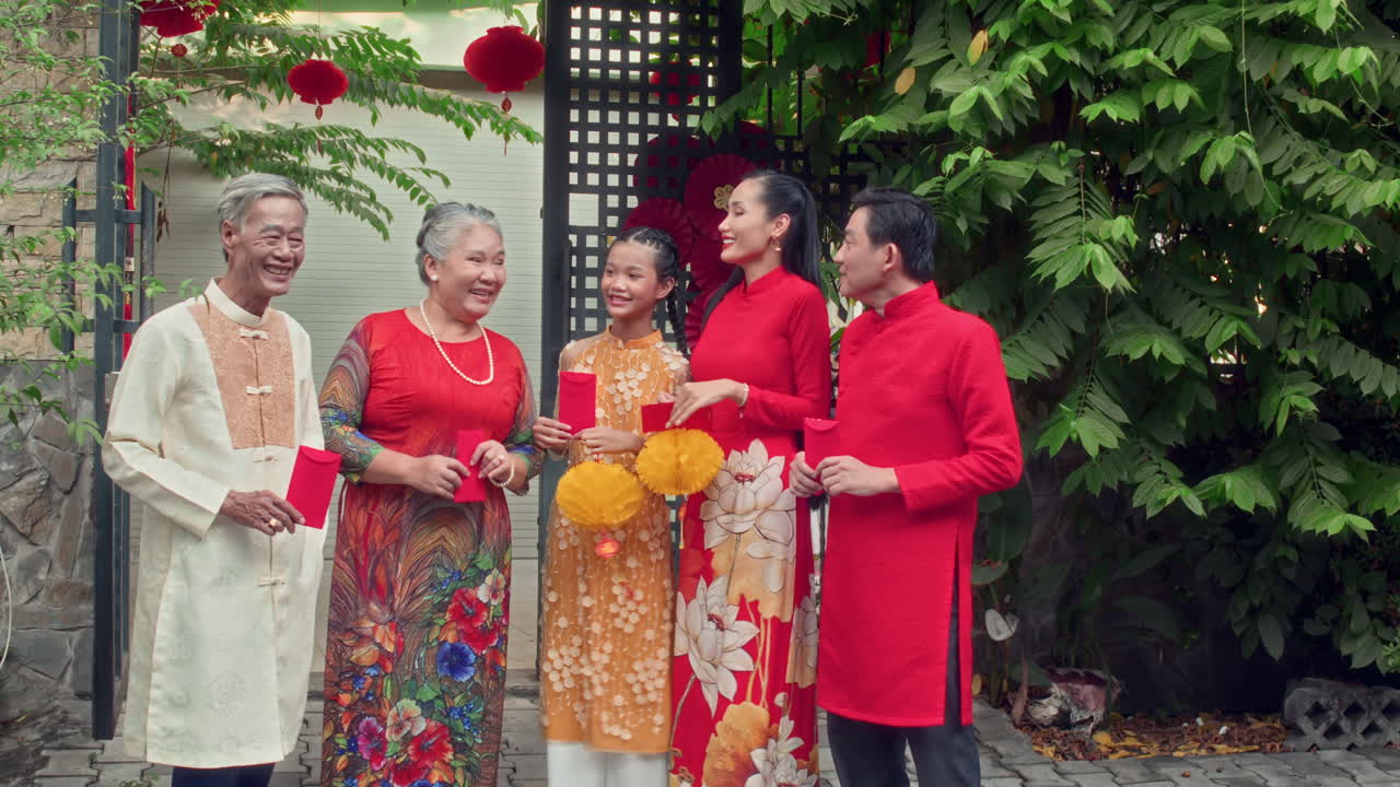 Big Vietnamese Family in Traditional Costumes Celebrating Tet