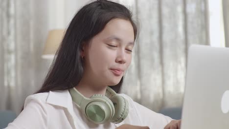 young woman working on laptop