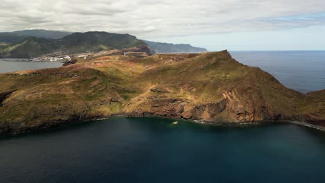Aerial-view-approaching-Ponta-de-sau-Lourenco-colourful-volcanic-island-coastline,-Madeira,-Portugal