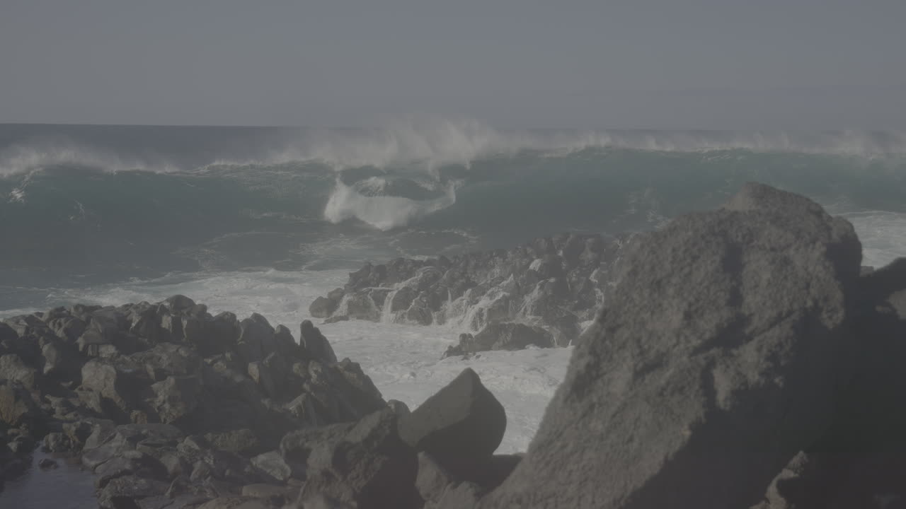 Powerful Waves Crashing on Rocky Coastline