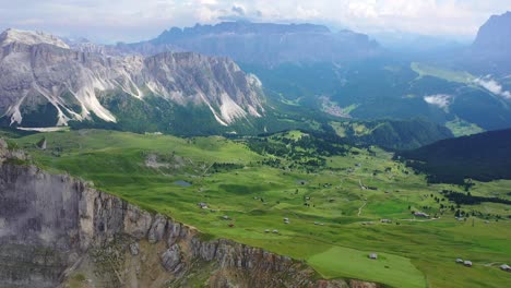 seceda mountain and val gardena valley in summer, pull back aerial