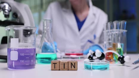 science laboratory experiment with 'tin' element blocks