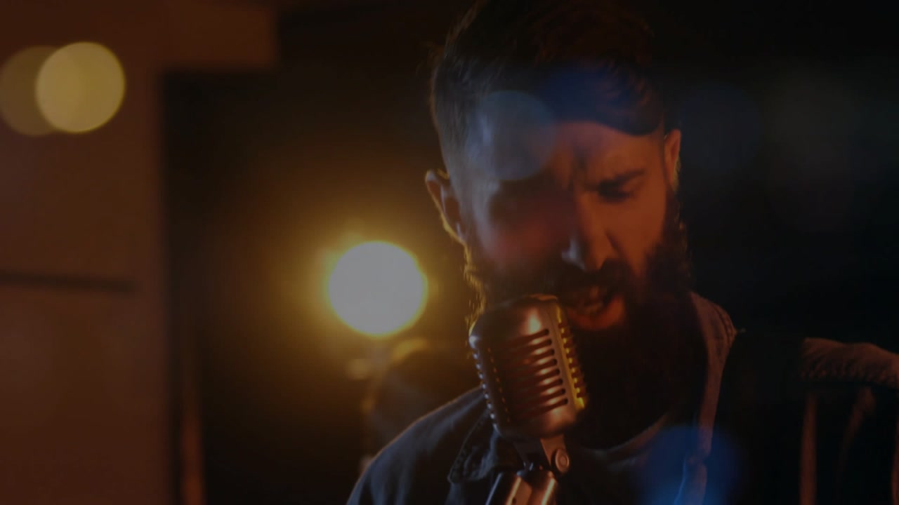 Drummer starting, camera moving from guitar to lead singer singing, ending on backup singer music
