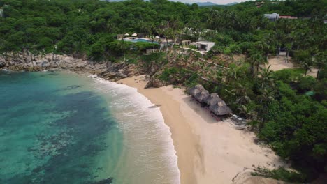 Aerial-video-of-landscape-along-the-mesmerizing-coastline-in-Huatulco,-Mexico