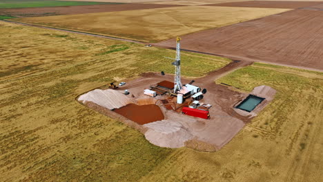 site for industrial production of oil or gas. drone footage above the location drilling natural resources in the field.