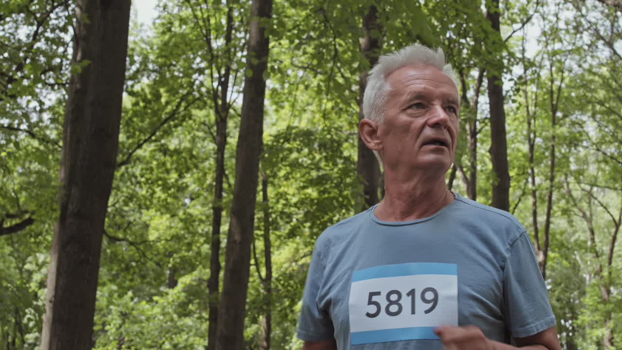Senior Man Running in the Forest