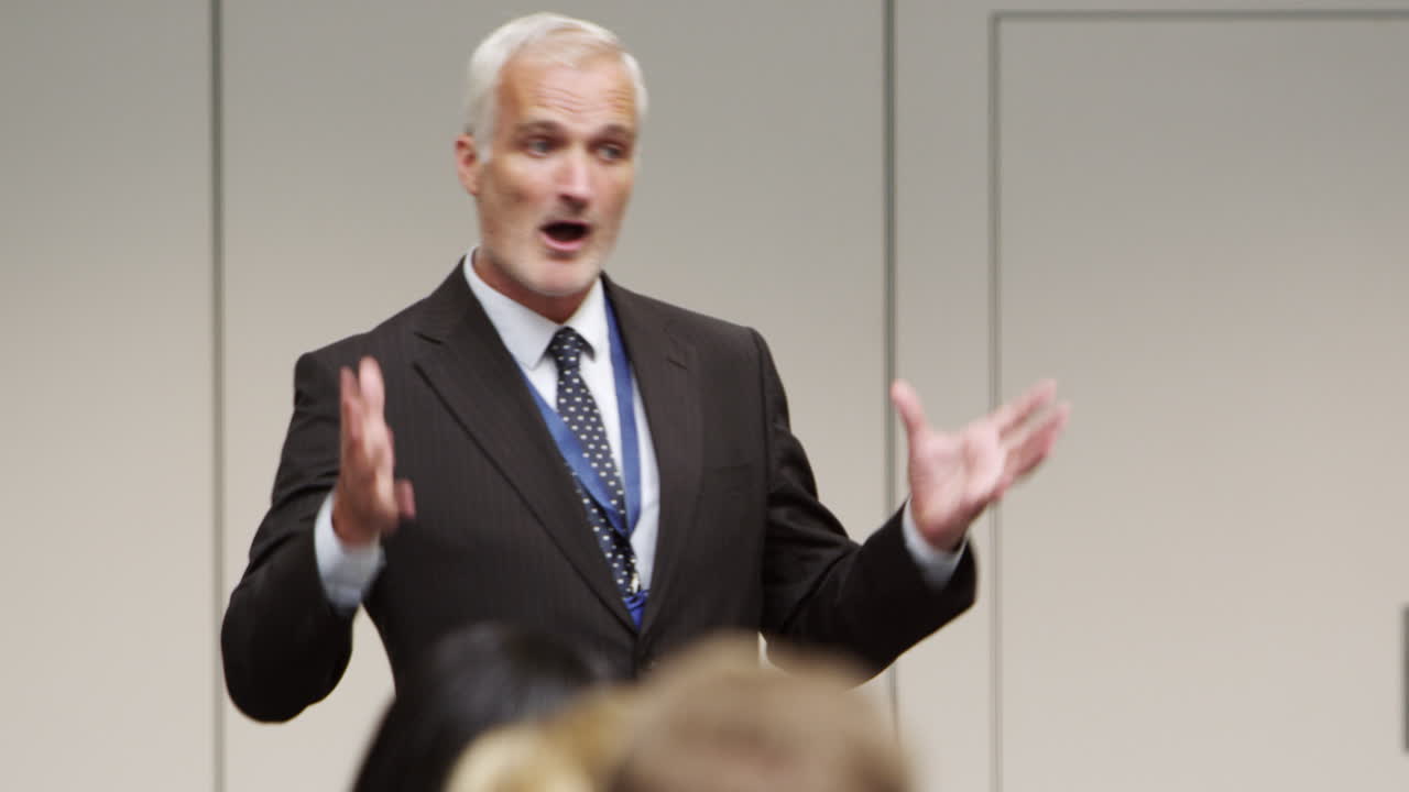 Businessman Making Presentation At Conference Shot On R3D