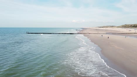 long groynes at a beach in the netherlands