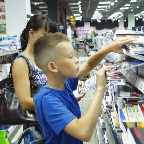 vinnitsa, ukraine - august 20, 2018: child choosing school stationery in store