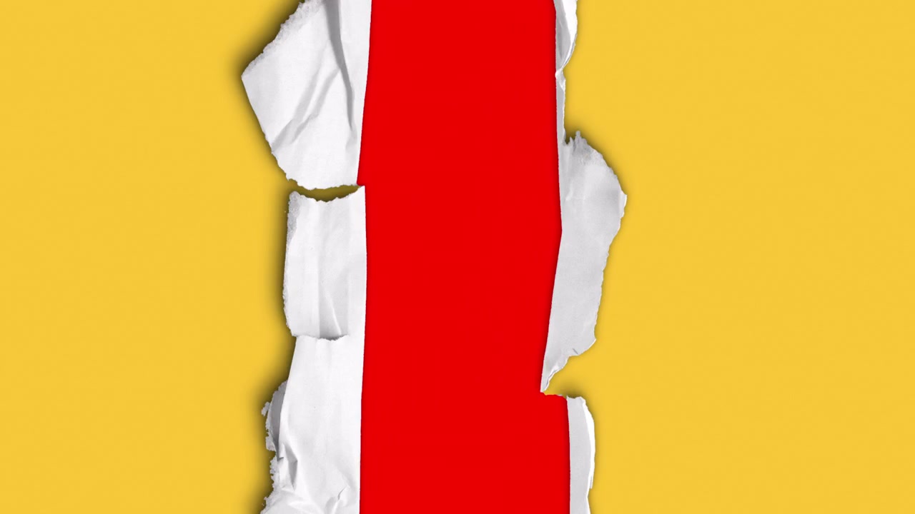Gelbes Papier reißt auf und enthüllt roten Hintergrund
