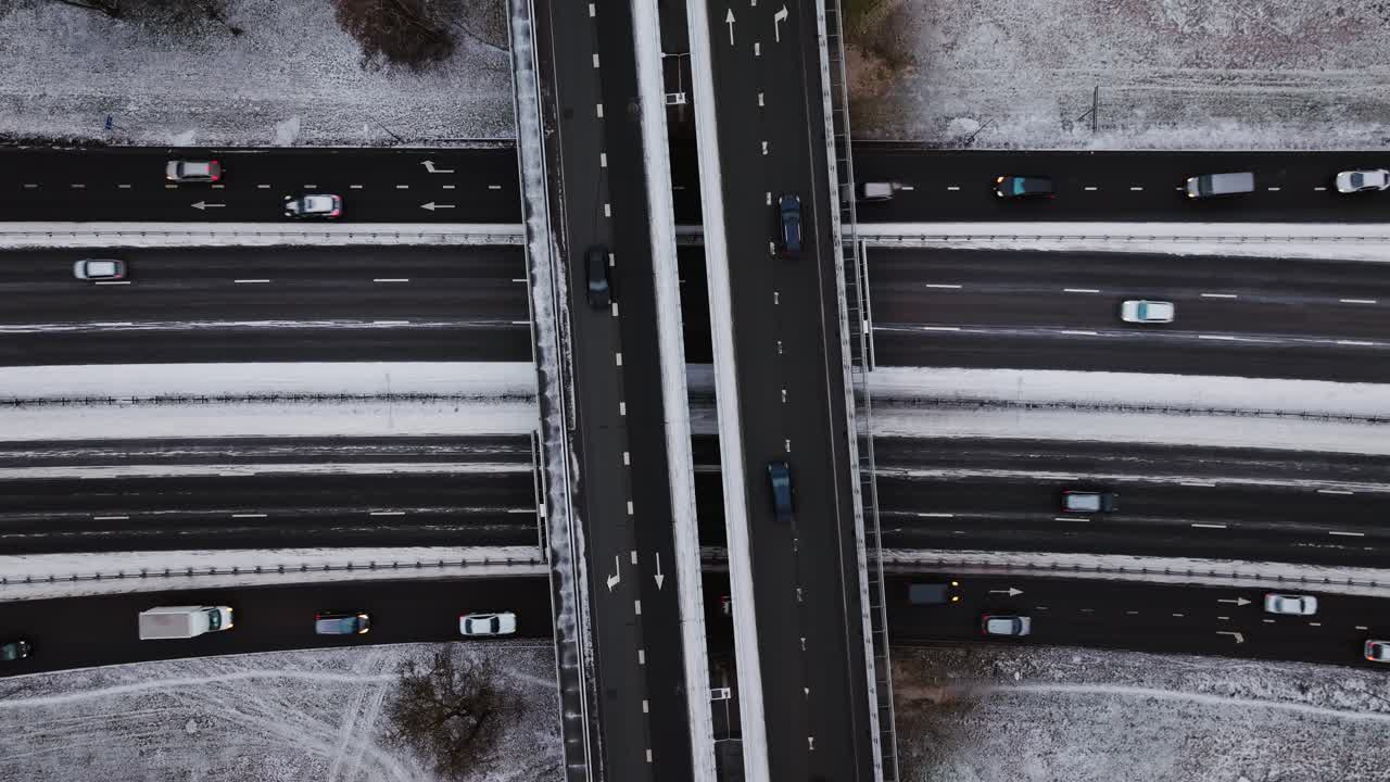 Symmetrical highway intersection covered in frost, viewed directly from above