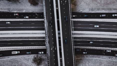 symmetrical highway intersection covered in frost, viewed directly from above