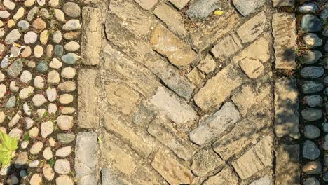 footsteps on a cobblestone path in italy