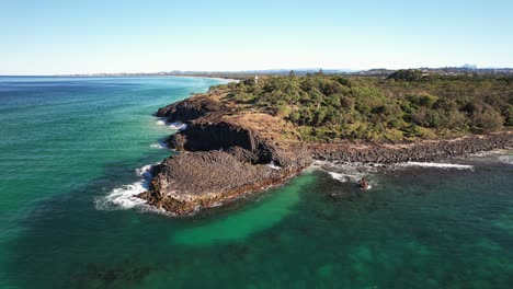 fingal headland and tasman sea in new south wales, australia - aerial pullback