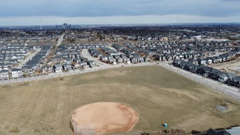 aerial view of a modern suburban community in calgary, canada, in spring after the snow melt