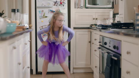 happy-ballerina-girl-dancing-in-kitchen-wearing-purple-tutu-having-fun-performing-funny-dance-moves-enjoying-weekend-celebration-at-home