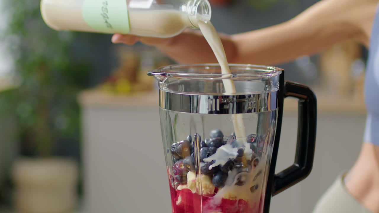 Adding Plant Milk to Blender for Making Smoothie