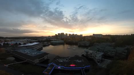 Drone-flight-over-the-city-at-sunset