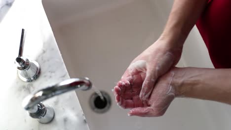 Top-Down-View-Of-Man-Washing-Hands-In-Slow-Motion