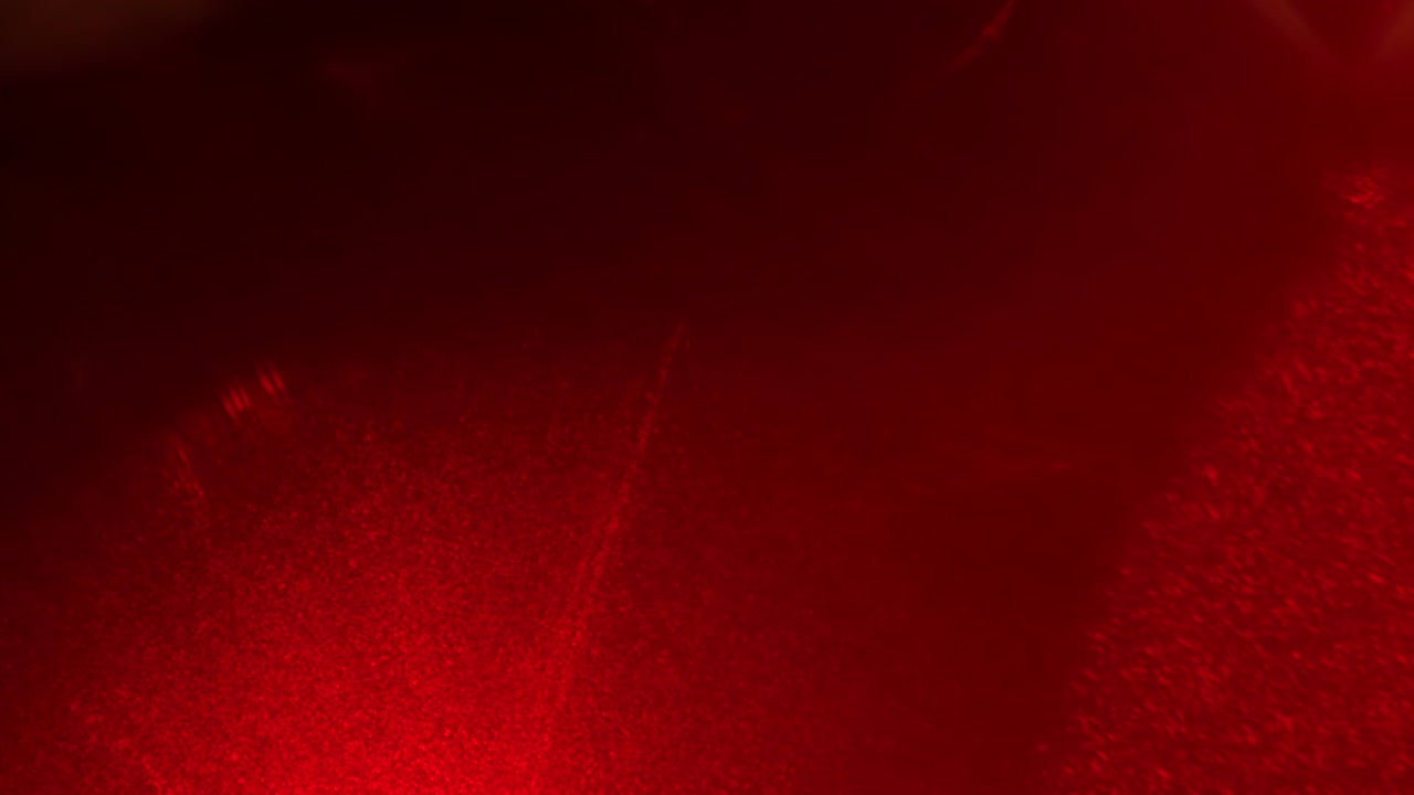 Sfondi video astratti rosso scuro con texture a grana di polvere