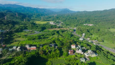 forest of north west taiwan, close´to city hsinchu 新竹鎮. houses and homes between farm fields and nature in summer. aerial top down shot.