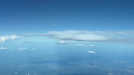 Aerial-view-of-a-rare-lenticular-cloud-recorded-from-a-jet-cabin-flying-at-12000m-high