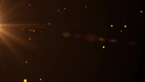 animación de múltiples focos amarillos brillantes que se mueven sobre un fondo negro