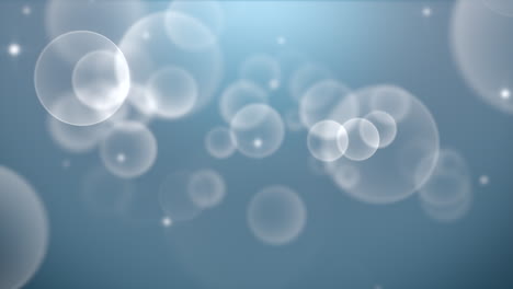 Motion-and-fly-white-particles-and-round-bokeh-on-dark-blue-background