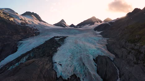 snow-capped mountain slope under a shining sunlight